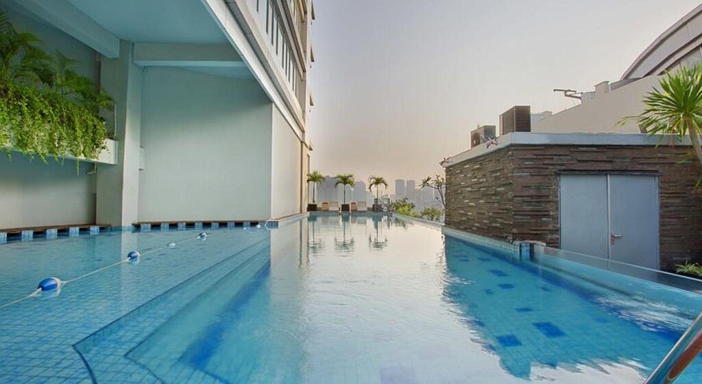 해리스 스위트 fX 수디르만 (HARRIS Suites fX Sudirman) 객실 및 시설